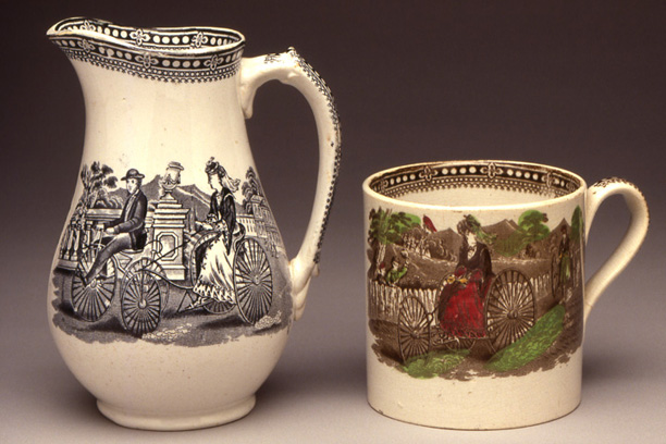 Pitcher & Mug, ca. 1869<br>
Treadle-drive Tricycle<br>
Pottery, transfer prints<br>
England